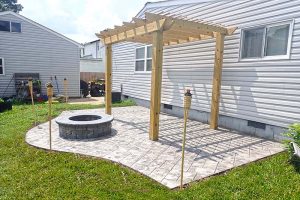 Stamped Concrete Patios with Fire Pits and Pergolas in Norfolk